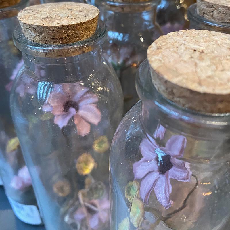 Dried-flowers-in-glass-bottles